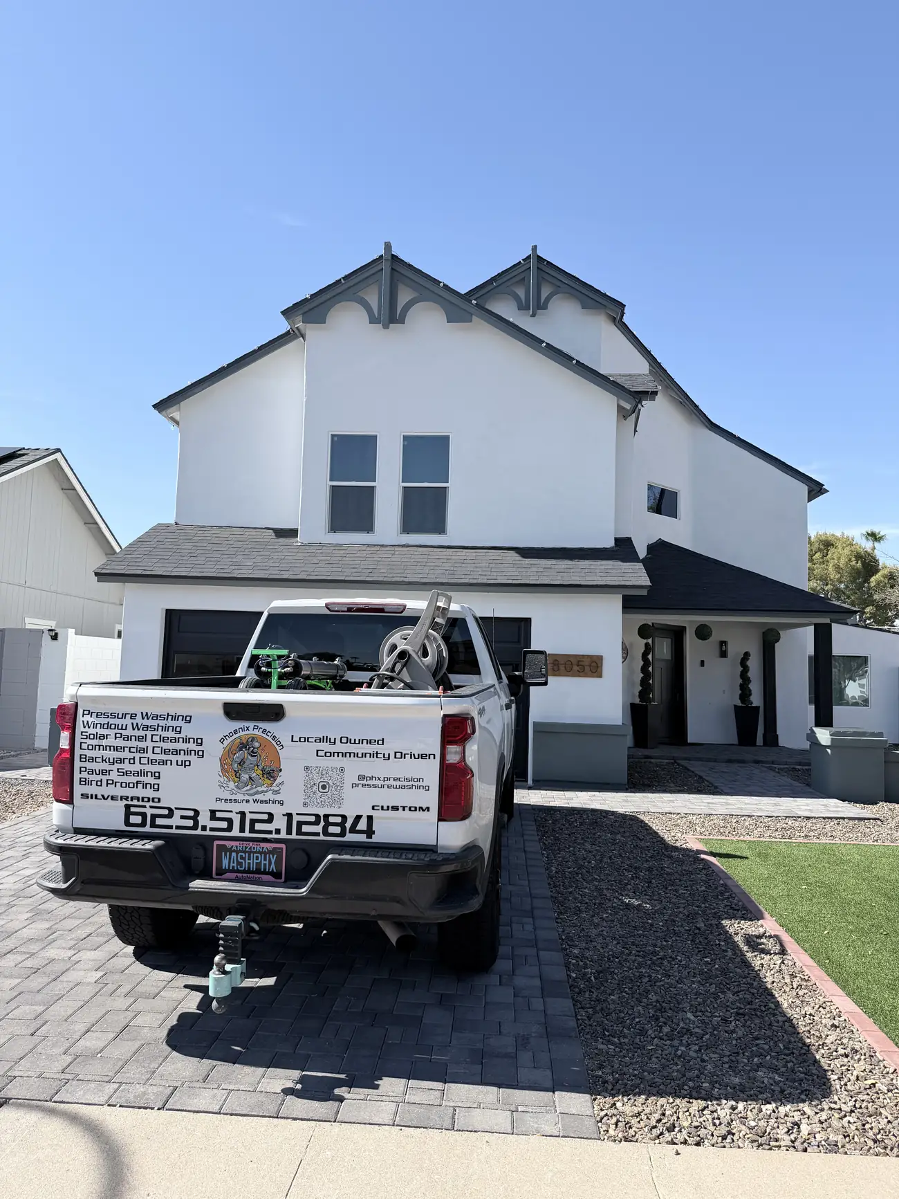 Phoenix Precision Pressure Washing branded truck parked outside a home in the Phoenix Valley